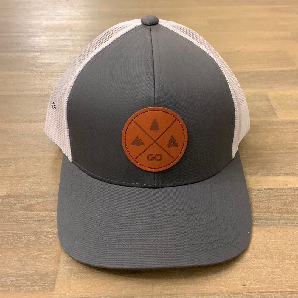 LINDO baseball hat with a camping logo on the front